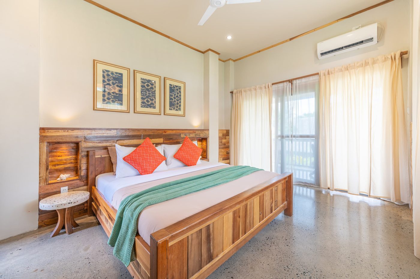 The Residence — bedroom with reclaimed-wood accent wall