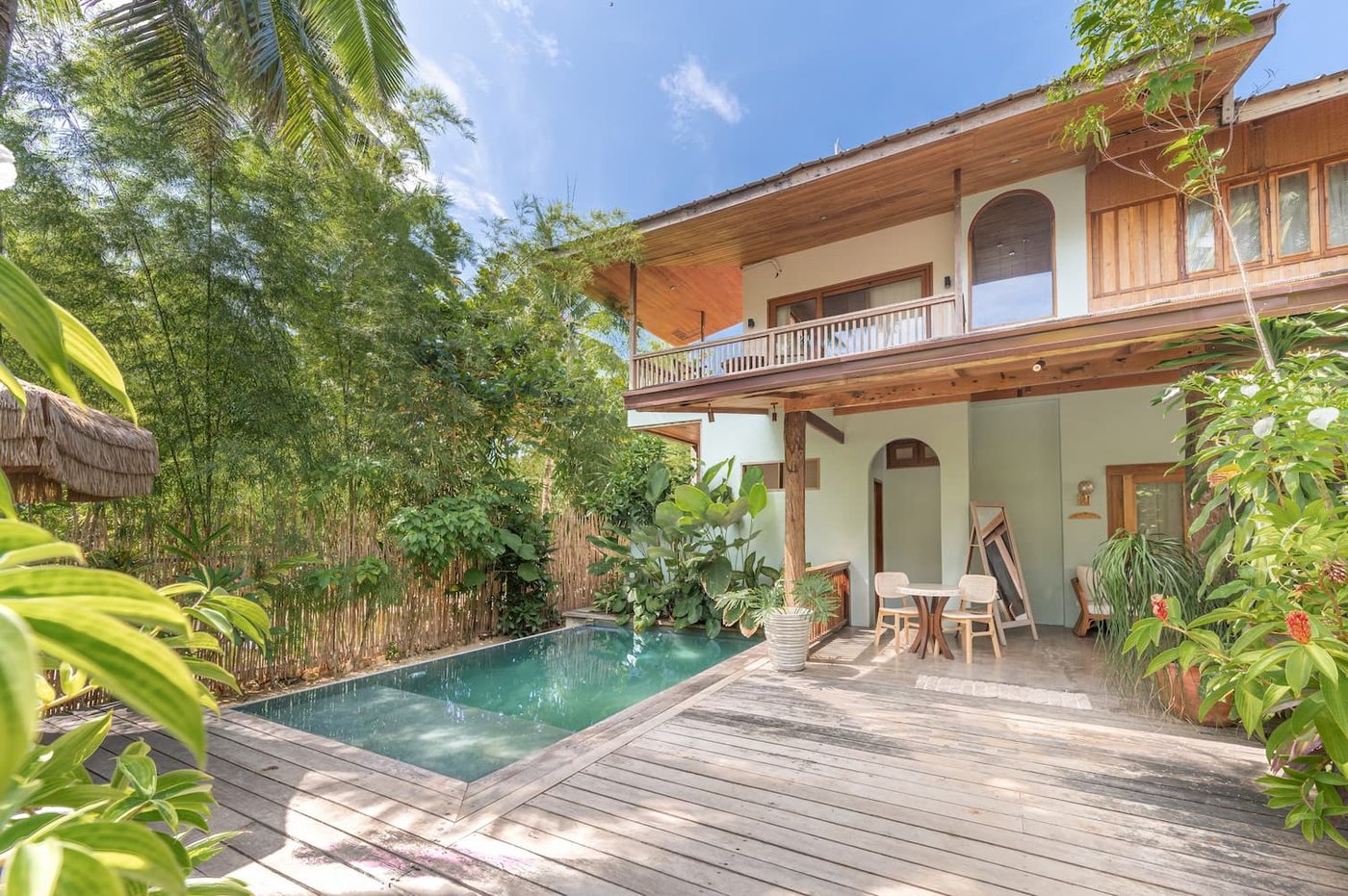 The Residence — pool, deck and house from the garden